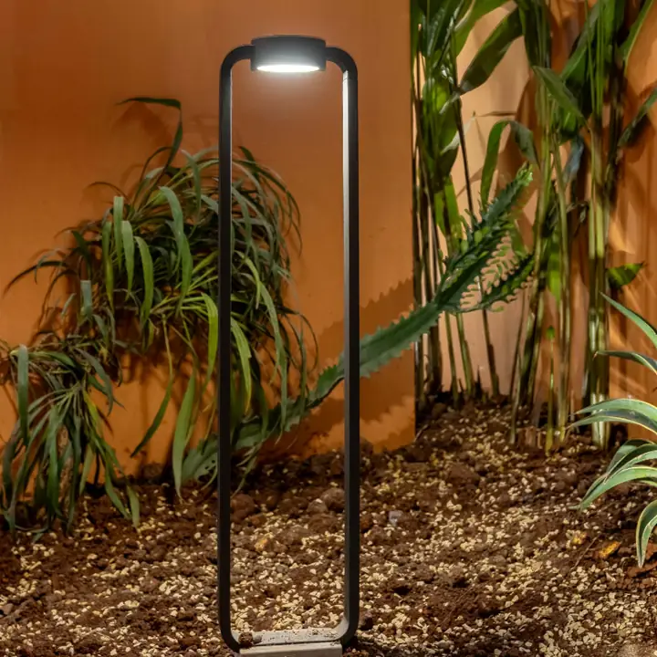 ALCM bollard standing in front of tall grasses