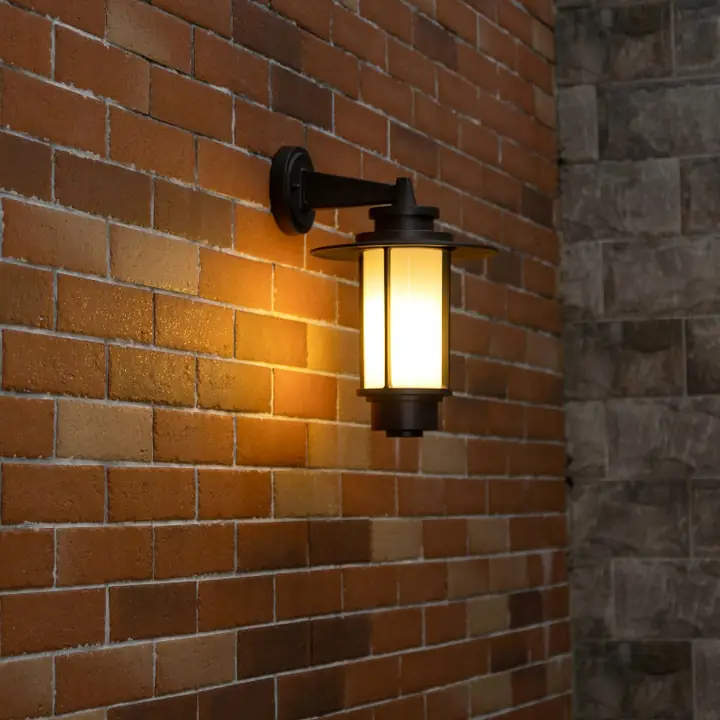 Archaios lantern sconce on a red brick wall