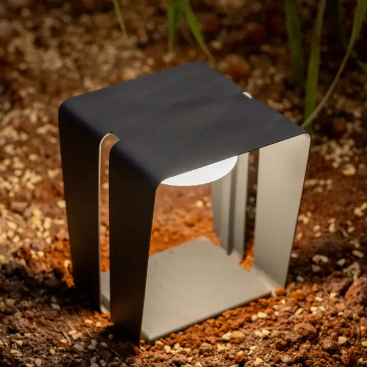 Chrono bollard sitting low in a bed of bark mulch