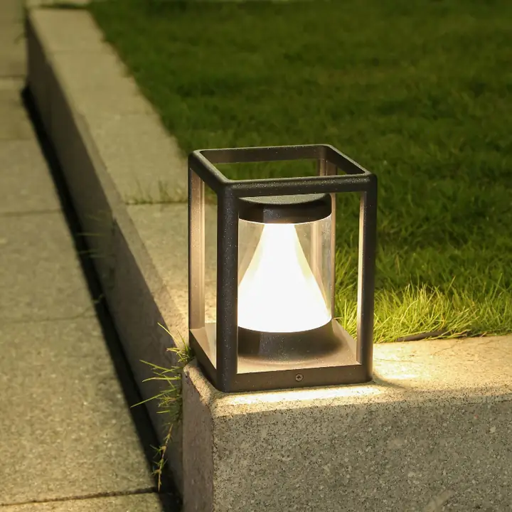 Comp gate light on a low wall beside a lawn