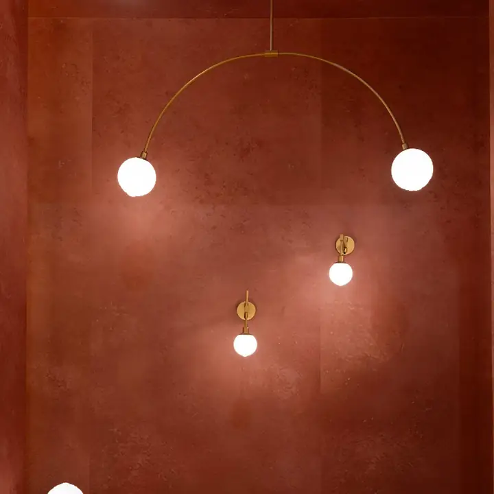 Lindor pendants with milky glass spheres on slender arms