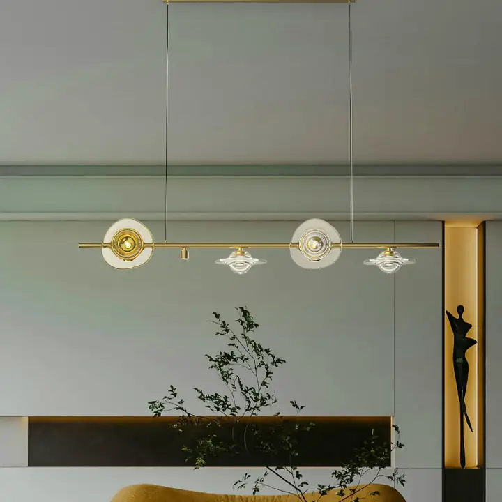Potiri pendants with amber glass shades in matte gold