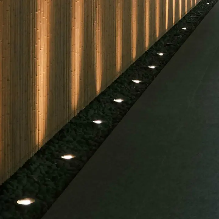 Tema in-ground lights grazing a slatted timber wall