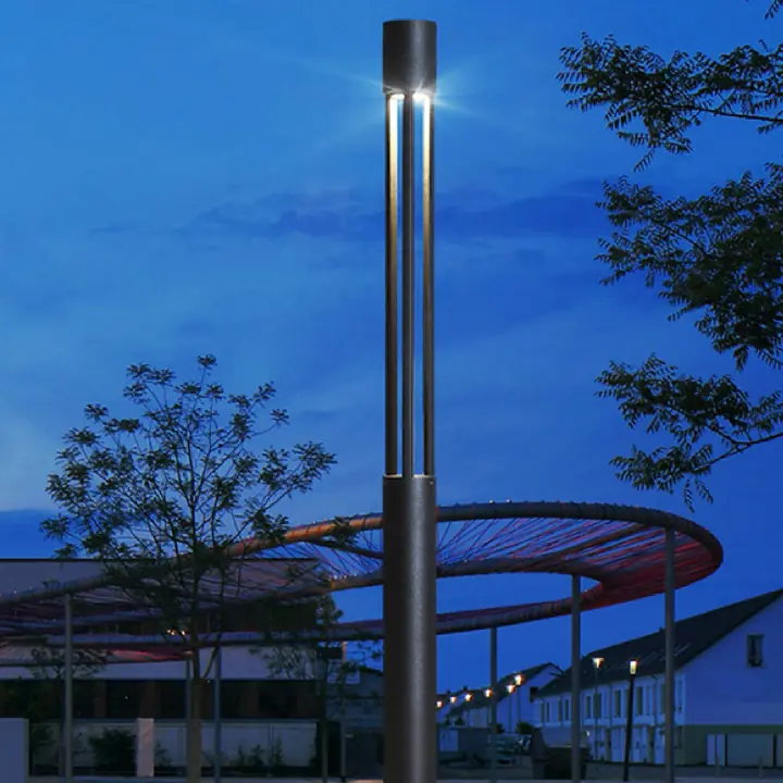Tower-P pole lights standing over a public plaza at dusk