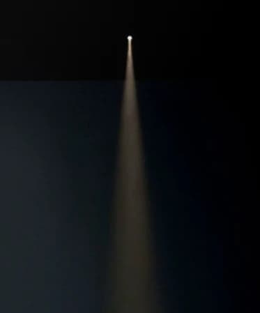 Venato spotlight throwing a narrow beam onto a sculpted bowl